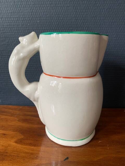 Hand-painted earthenware cream pot with cat handle, 19th century