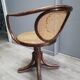 Office chair with curved wood swivel screw and Thonet cannage