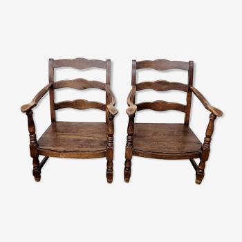 Two wooden armchairs