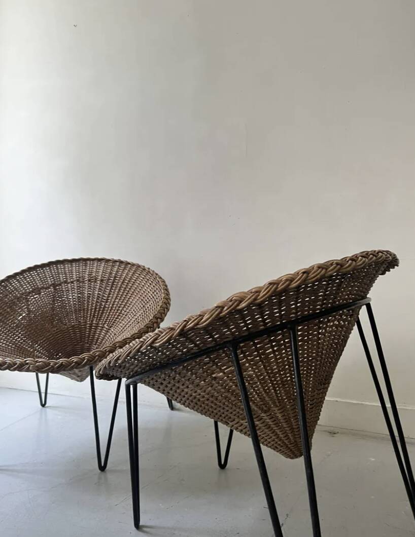 Italian basket chair in rattan and black metal, 1950s design.