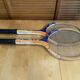Pair of vintage wooden tennis rackets for cadet junior sport courier