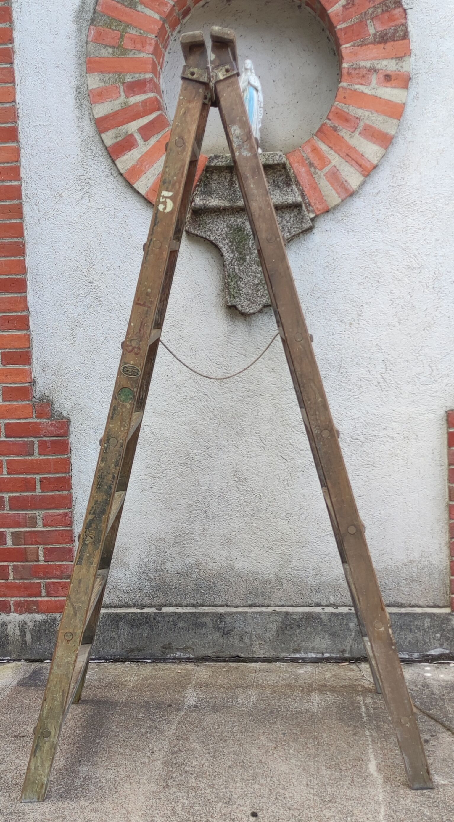 Old wooden stepladder stamped