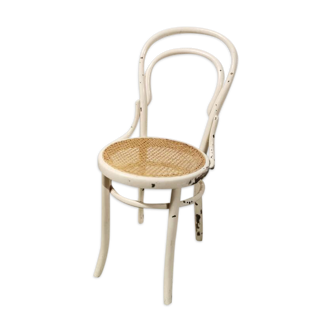 Curved wooden bistro chair and canned seat