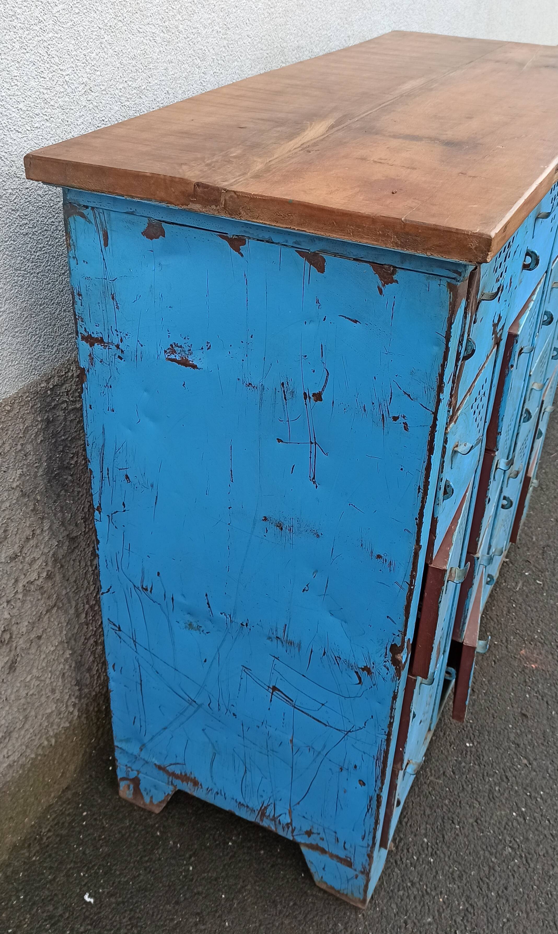 Old blue metal locker with wooden top