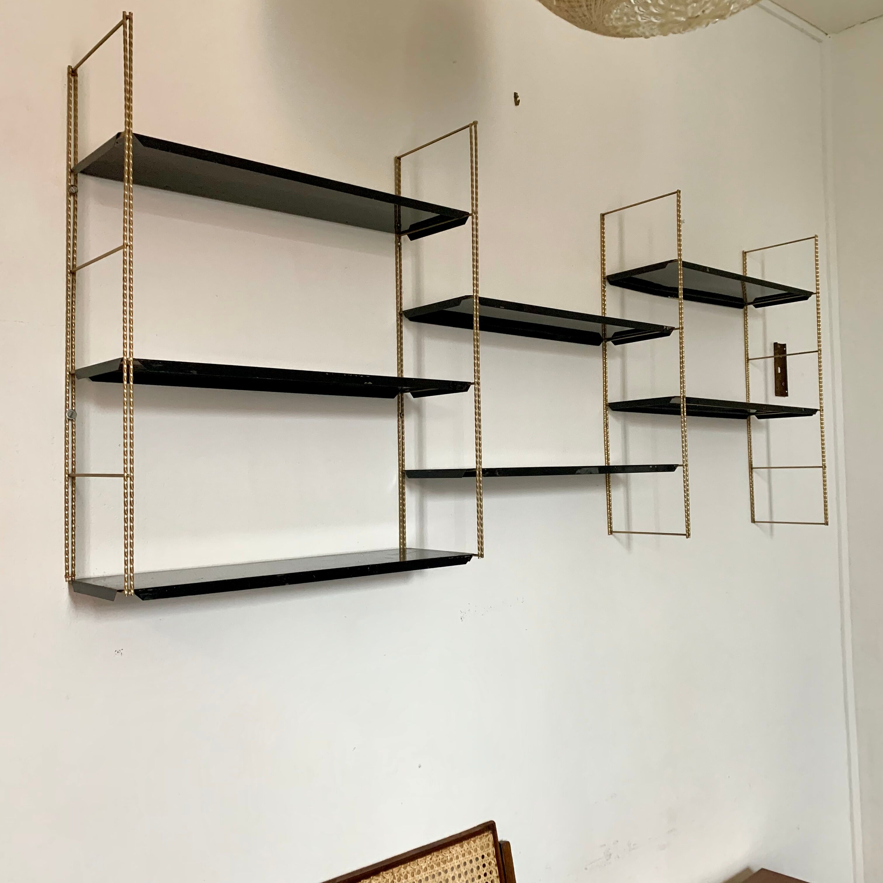 Vintage wall shelves in gold and black metal