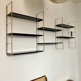 Vintage wall shelves in gold and black metal
