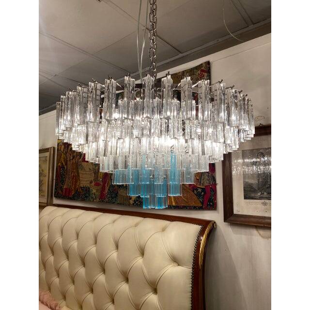 Contemporary transparent and ligh-blue triedro murano glass chandelier