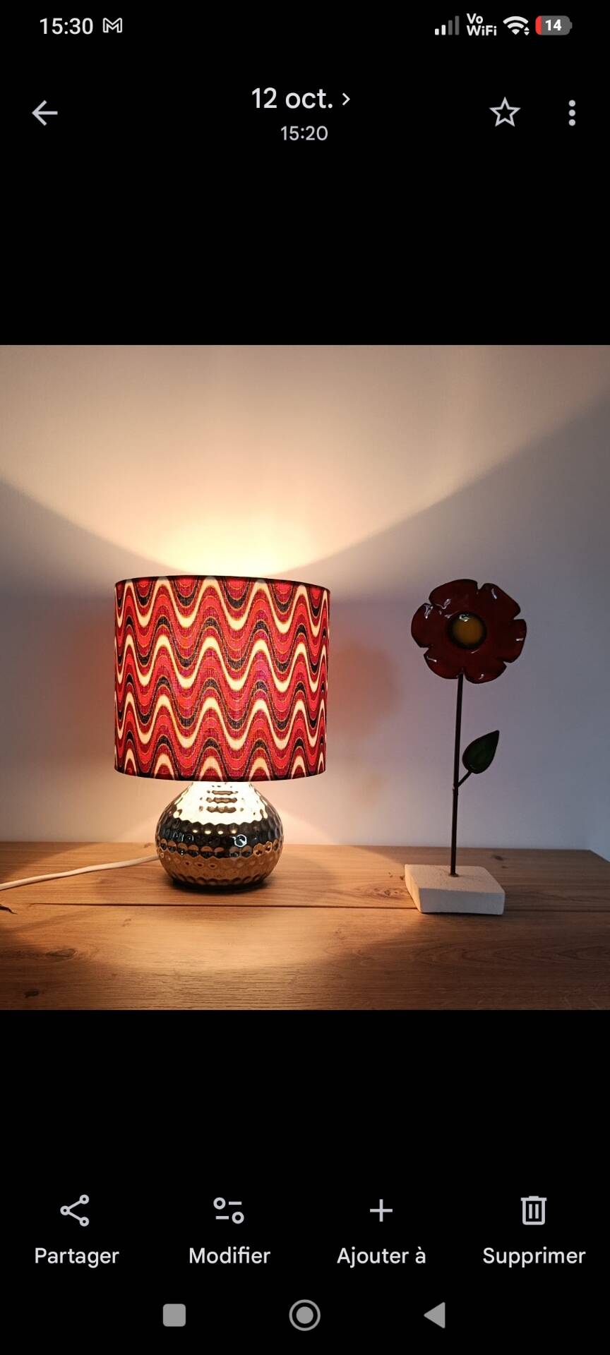 Vintage table lamp with printed shade featuring seventies waves.