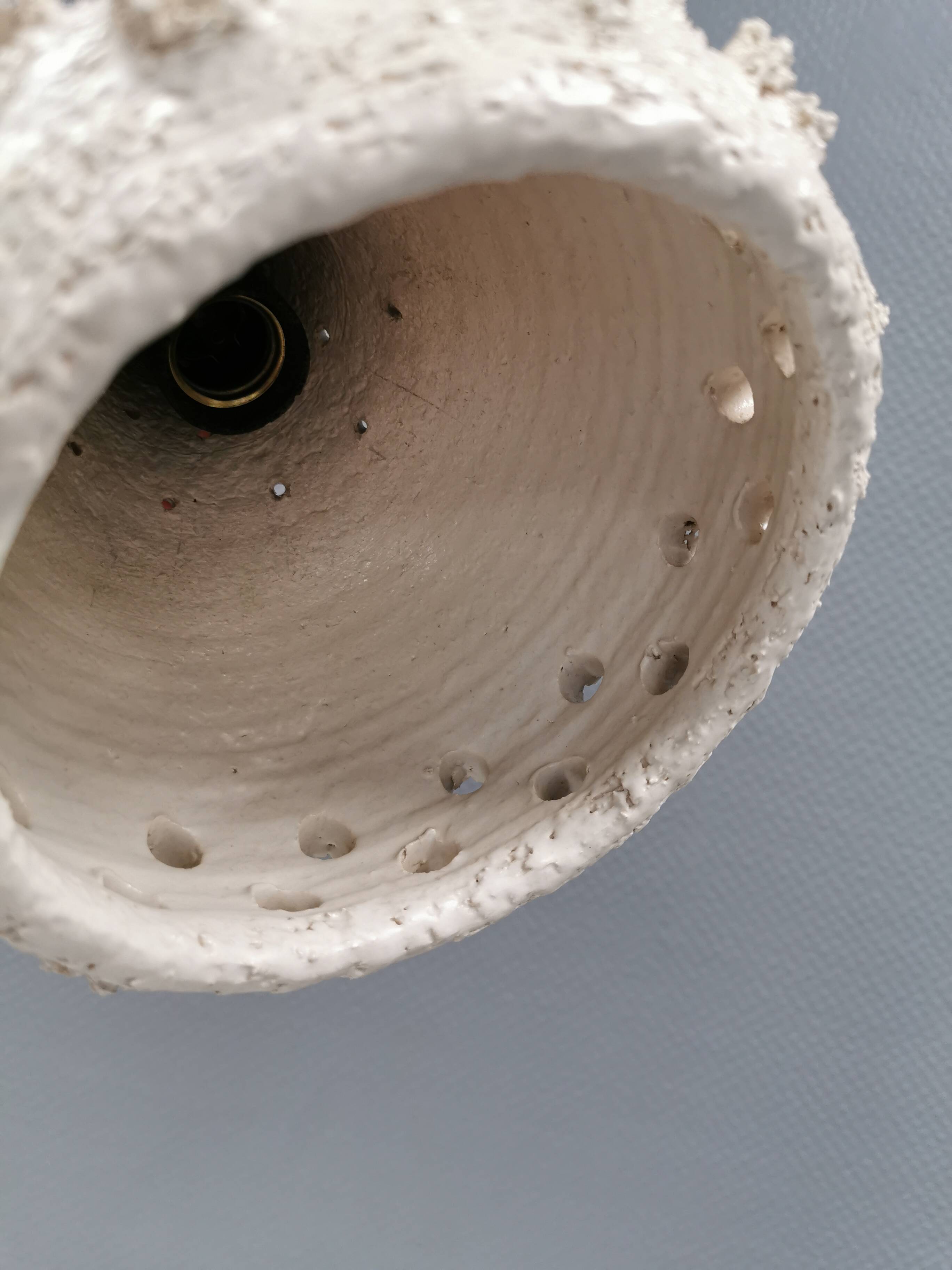 Two ceramic hanging lamps, in creamy white color, looking almost like coral