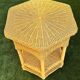 Vintage hexagonal rattan side table with original label, 1980.