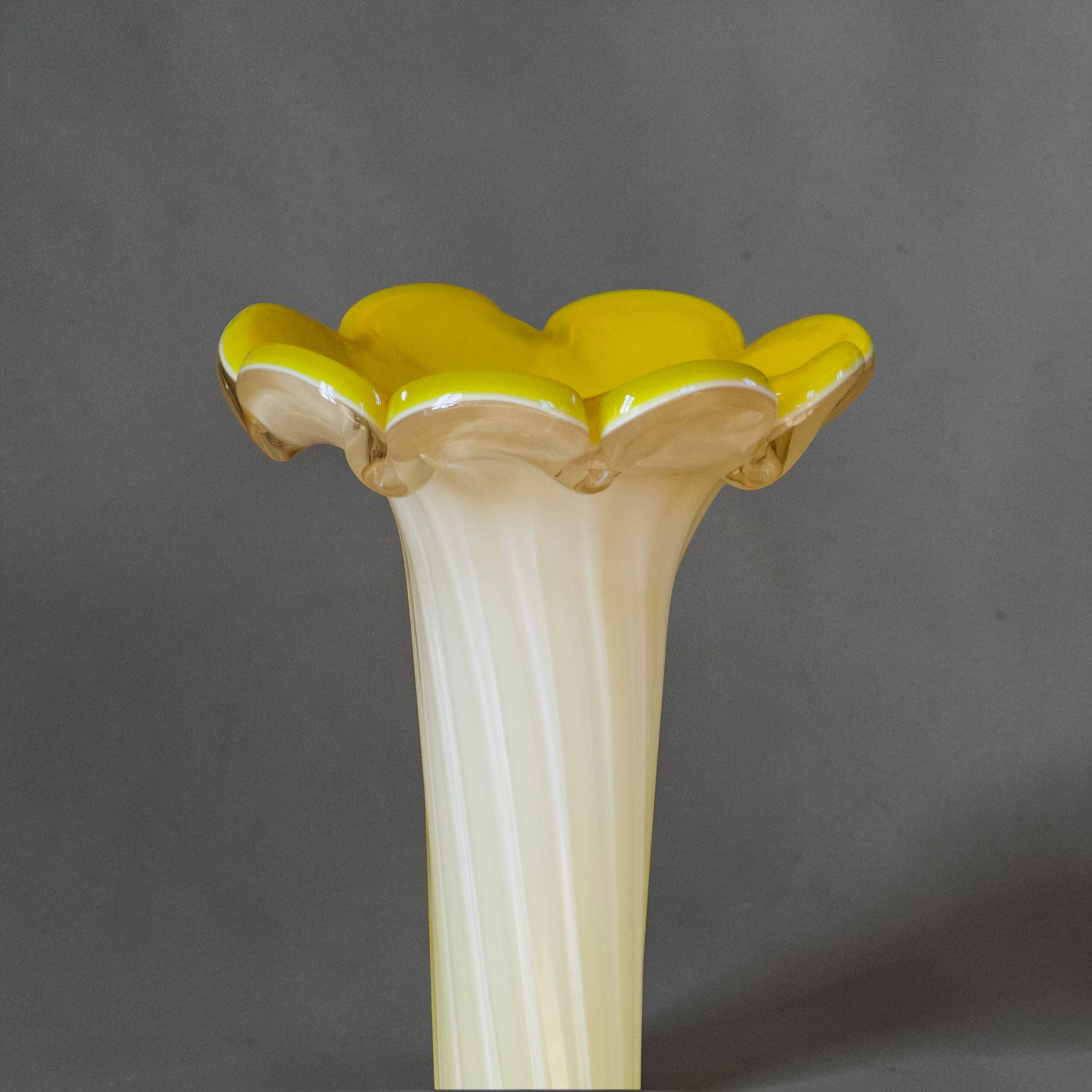 Blown glass vase from Murano in the shape of a yellow flower.