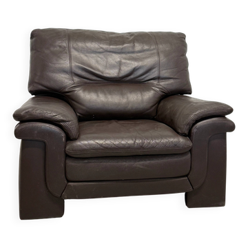 Vintage brown leather club armchair in 1980s style.