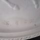 Large Chinese resin dish, sculpted motifs, signed