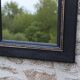 Vintage black and gold wooden mirror with a pediment – Napoléon III style