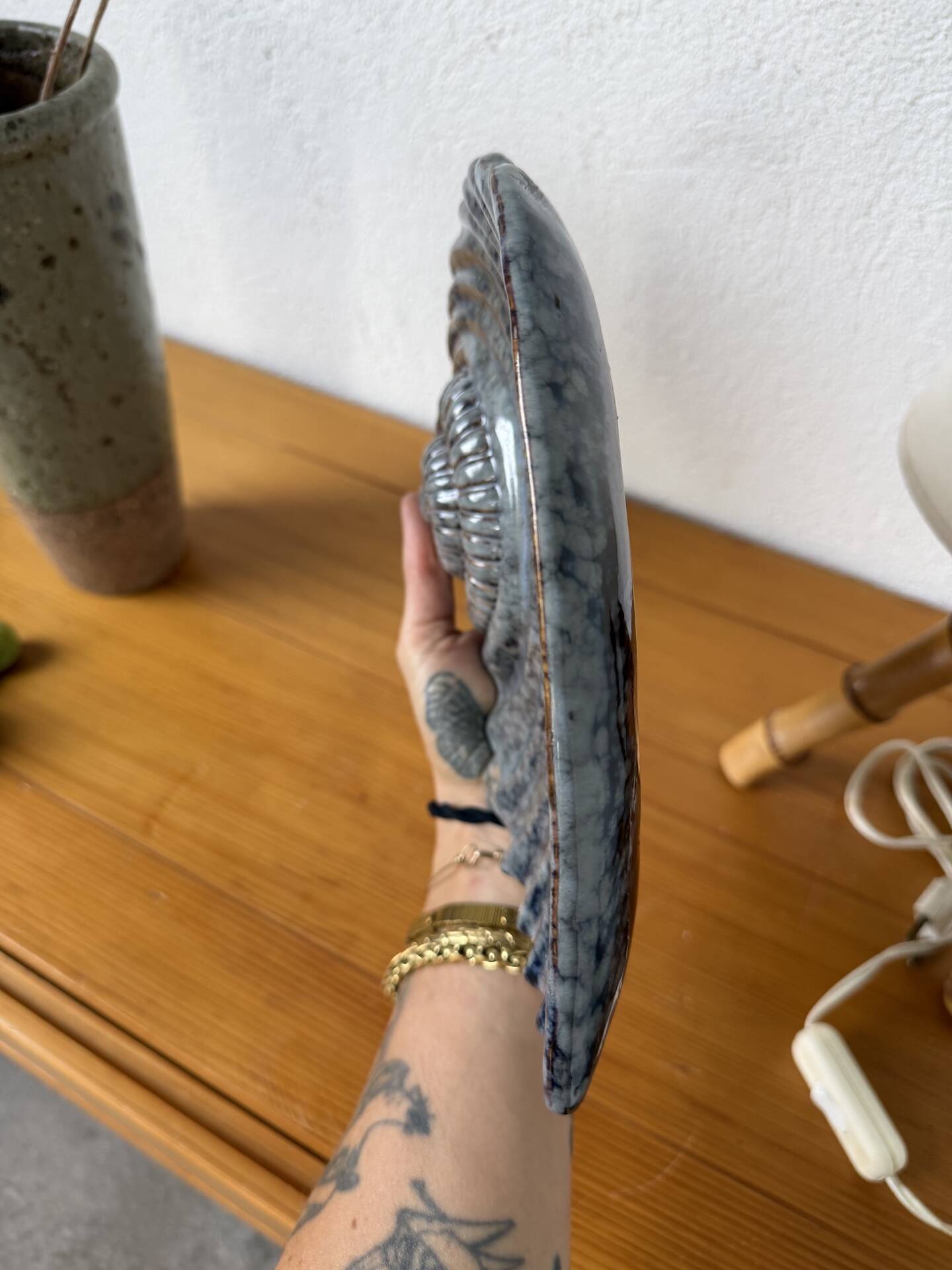 Shell-shaped ceramic catchall.