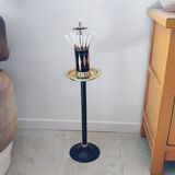 Vintage floor ashtray with a gold and black metal cigarette dispenser.