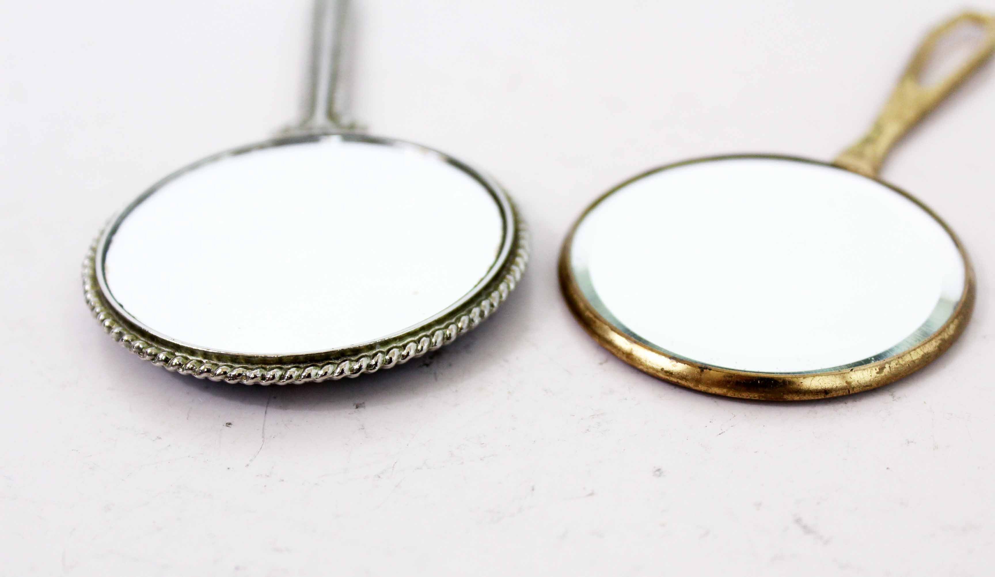 Old hand mirror duo