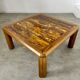 Old coffee table with golden marble top, 70s design, vintage wooden feet