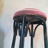 Black stool sitting in velvet rose