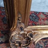 Old frame in wood and gilded stucco