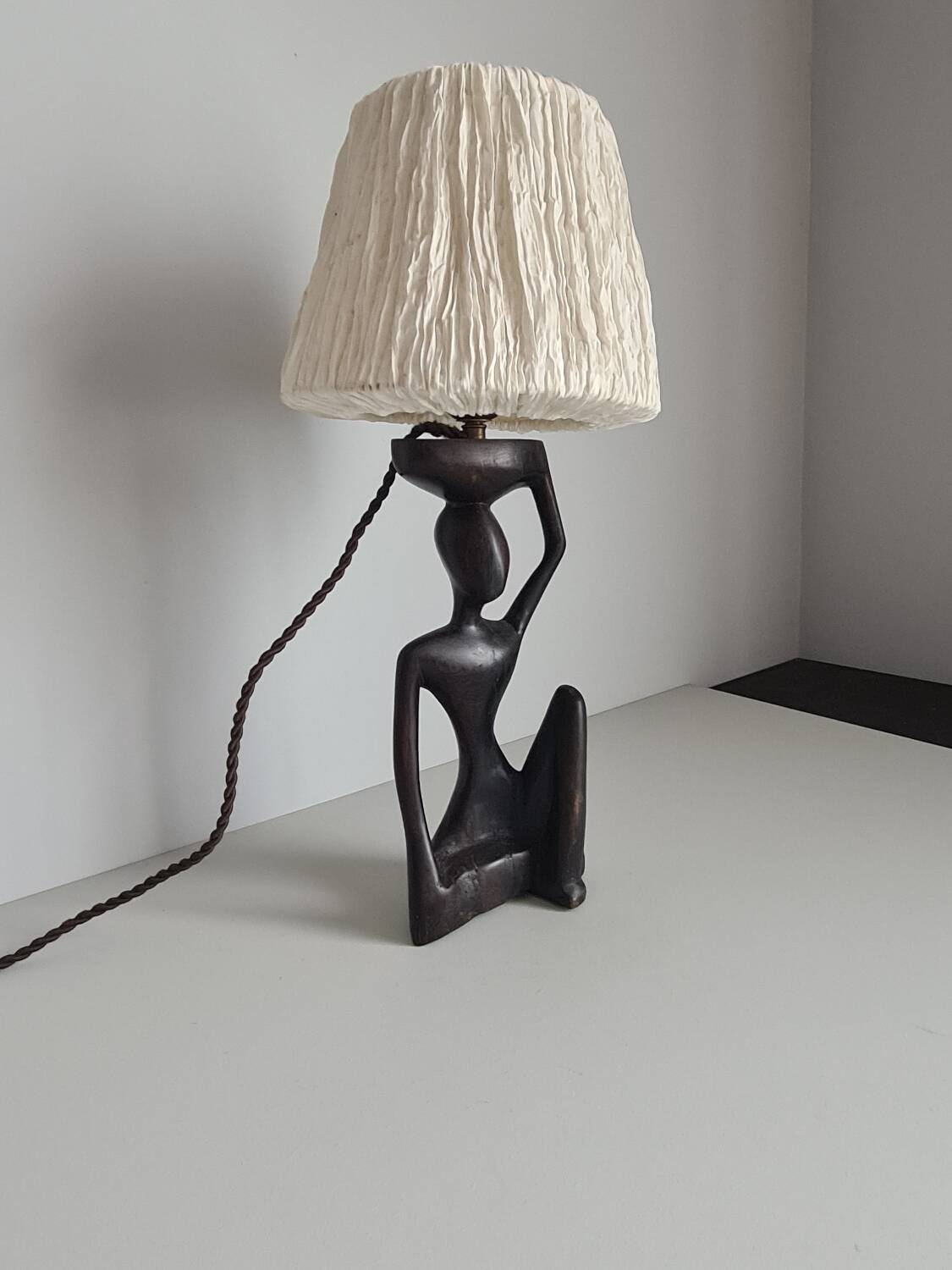 Ebony lamp with seated woman / 1930s