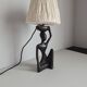 Ebony lamp with seated woman / 1930s