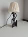 Ebony lamp with seated woman / 1930s