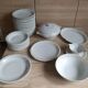 White Limoges porcelain tableware with gold trim.
