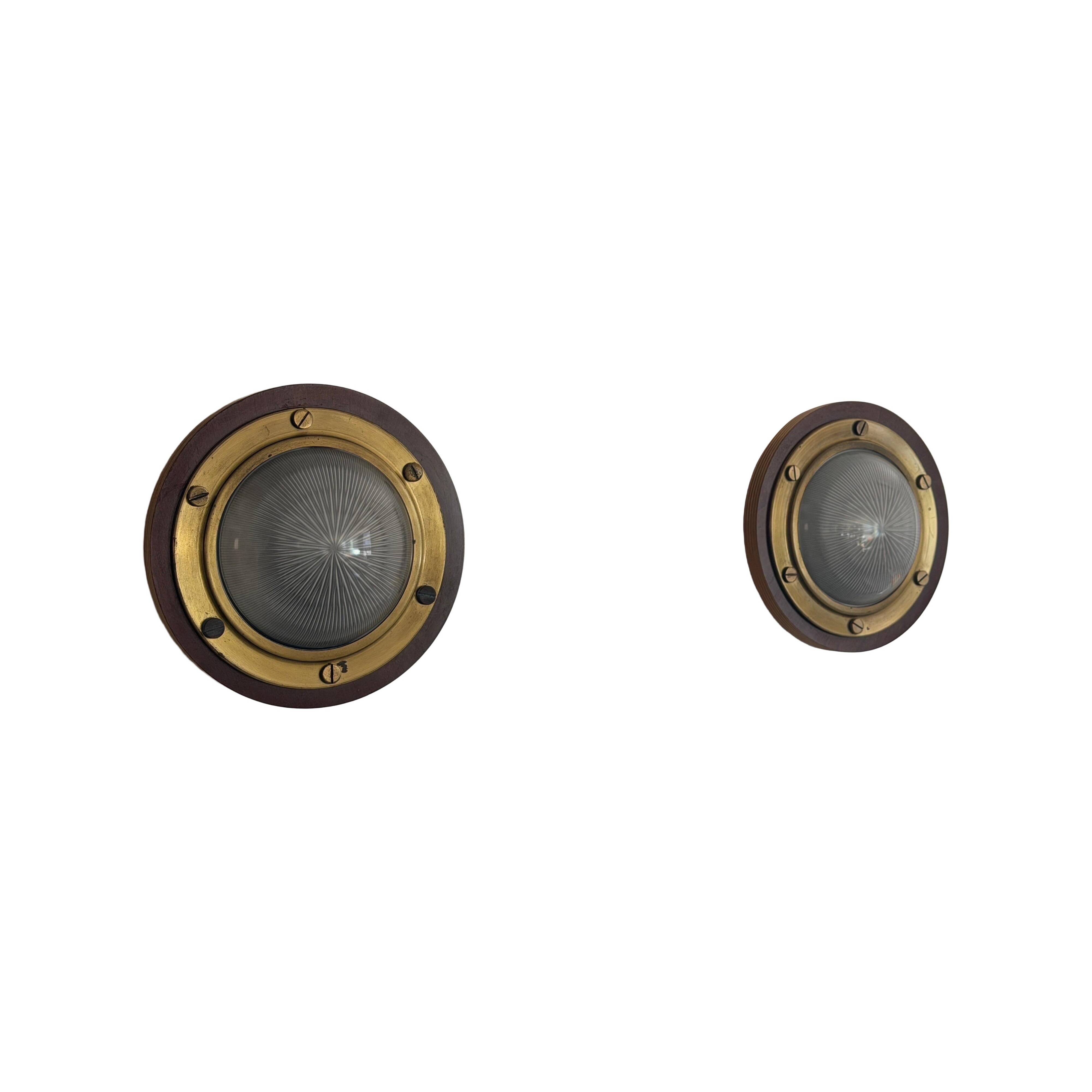 Pair of round glass wall lights, brass base and Wood Wood, 1960s, Italy.