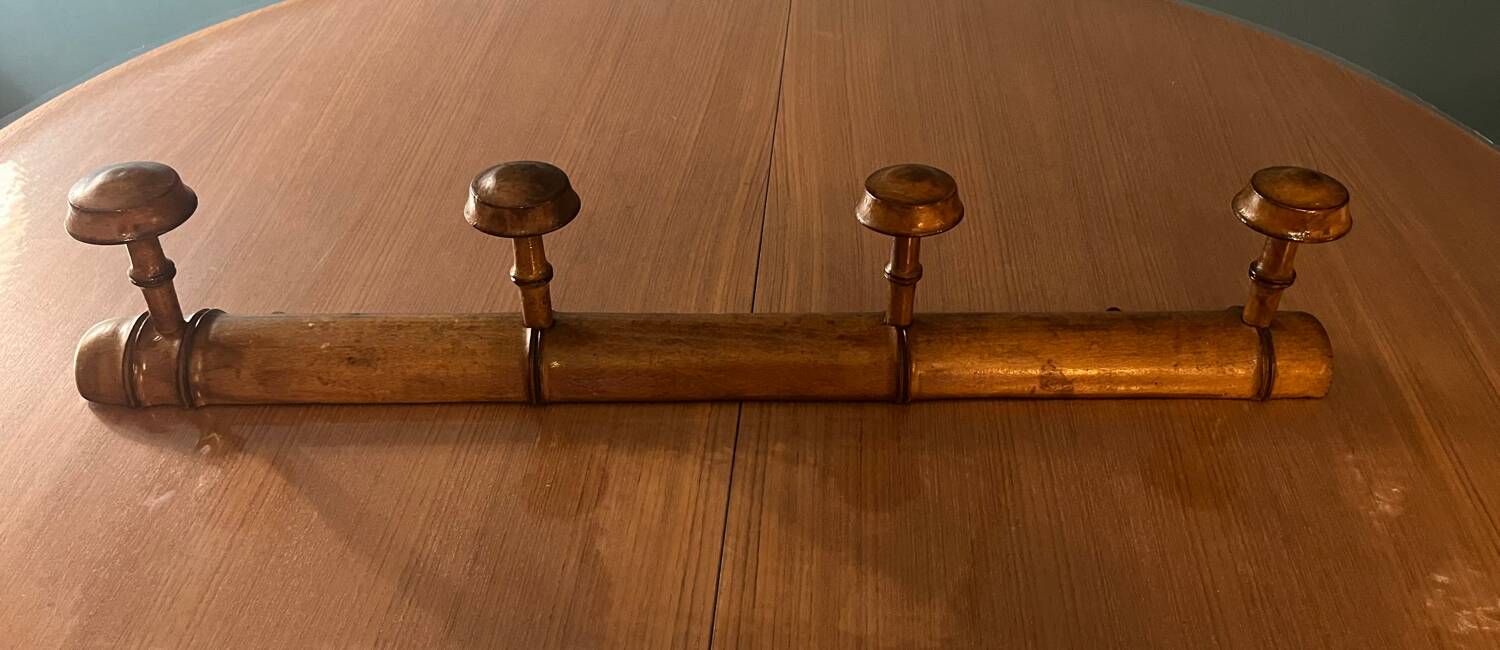 Old wooden wall coat rack