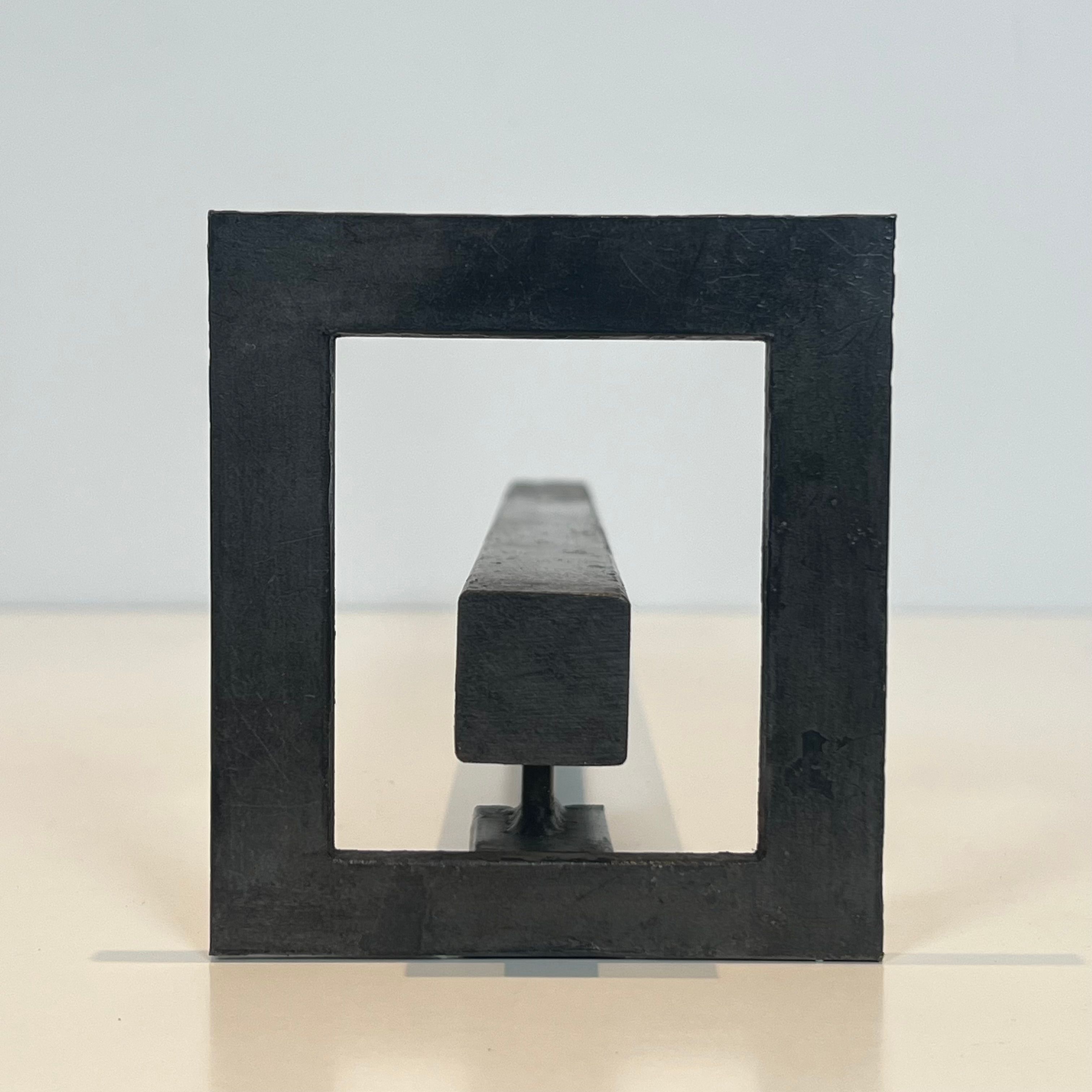 Pair of modernist andirons in steel and wrought iron