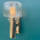 Wall lamp in stainless steel and globe in transparent glass