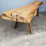 Big bench in solid rough wood very thick Brutalism