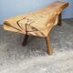 Big bench in solid rough wood very thick Brutalism