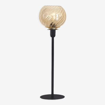 Table lamp with a vintage golden round lampshade