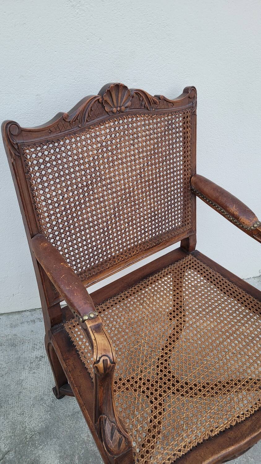 Louis XV Regency cane armchair leather armrests decorated with shell