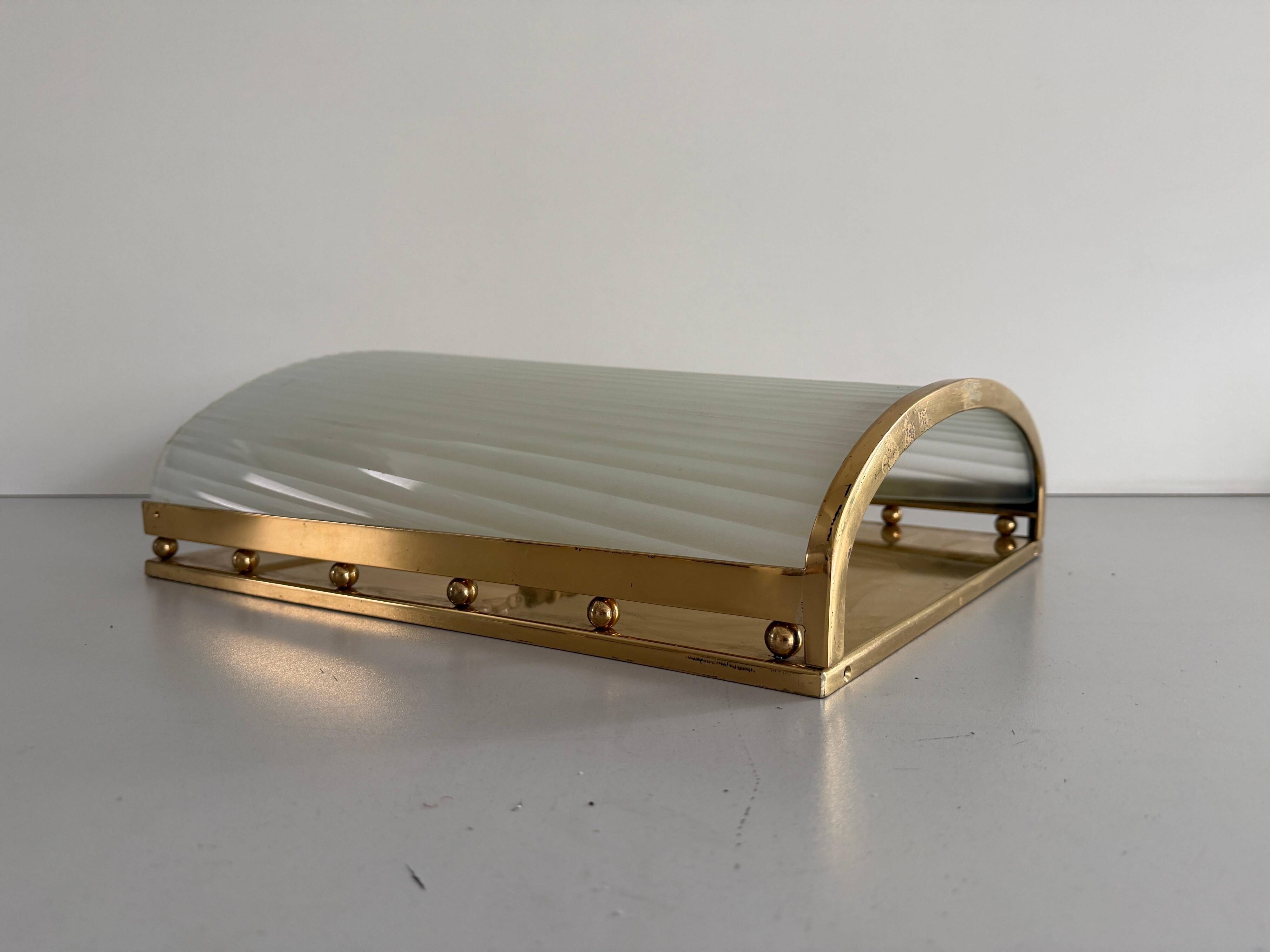 Large heavy glass wall light with a brass frame from the mid-century, 1950s, Italy.