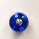 Bright blue glass salt and pepper shakers in a spherical shape.