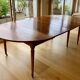Extendable round table in solid walnut, 125cm in diameter, 5 extensions.