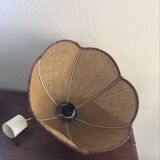 Two-tone flower hanging in braided straw.