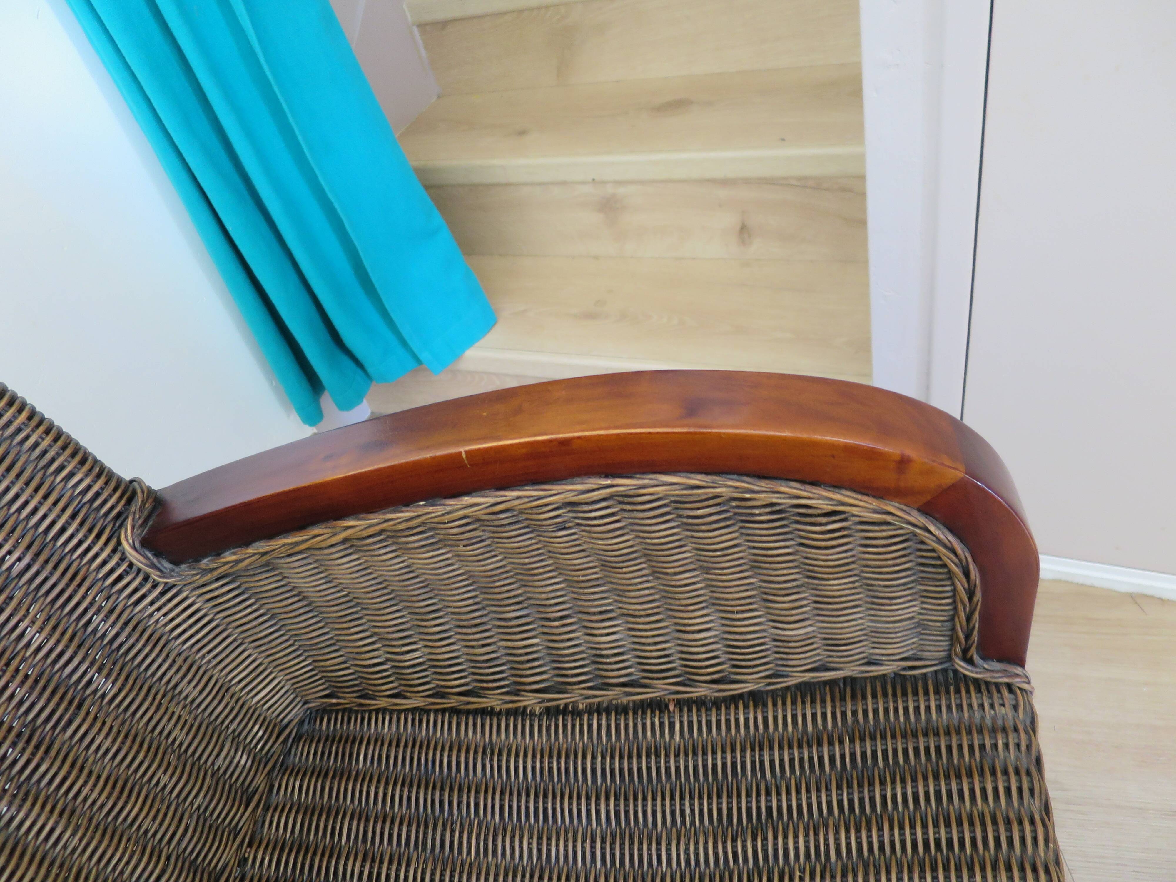 2 armchairs in woven rattan and wood, 1980s