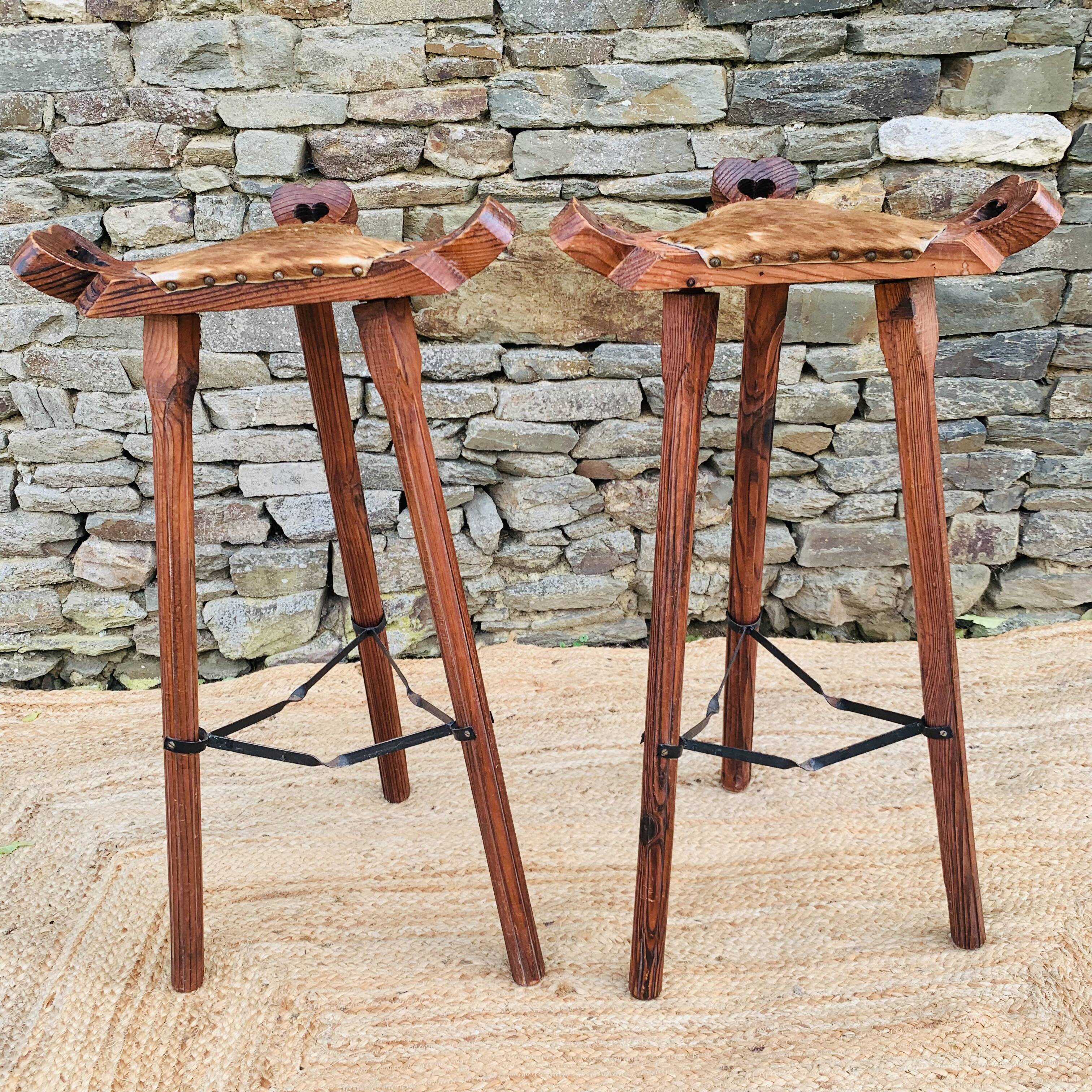 Set of 2 vintage high stools in cowhide and wood