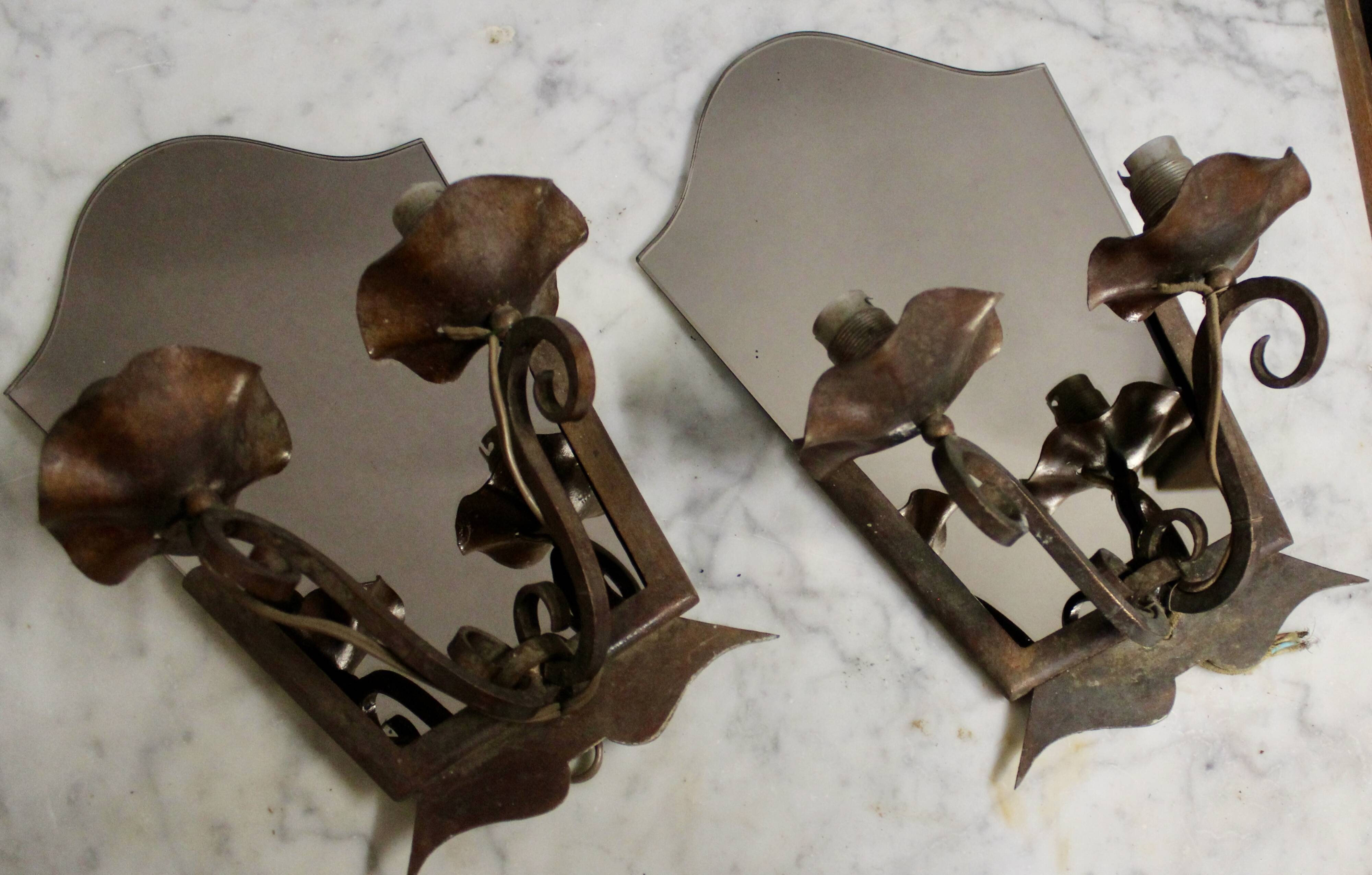 Pair of Art Deco wrought iron and smoked glass wall lights