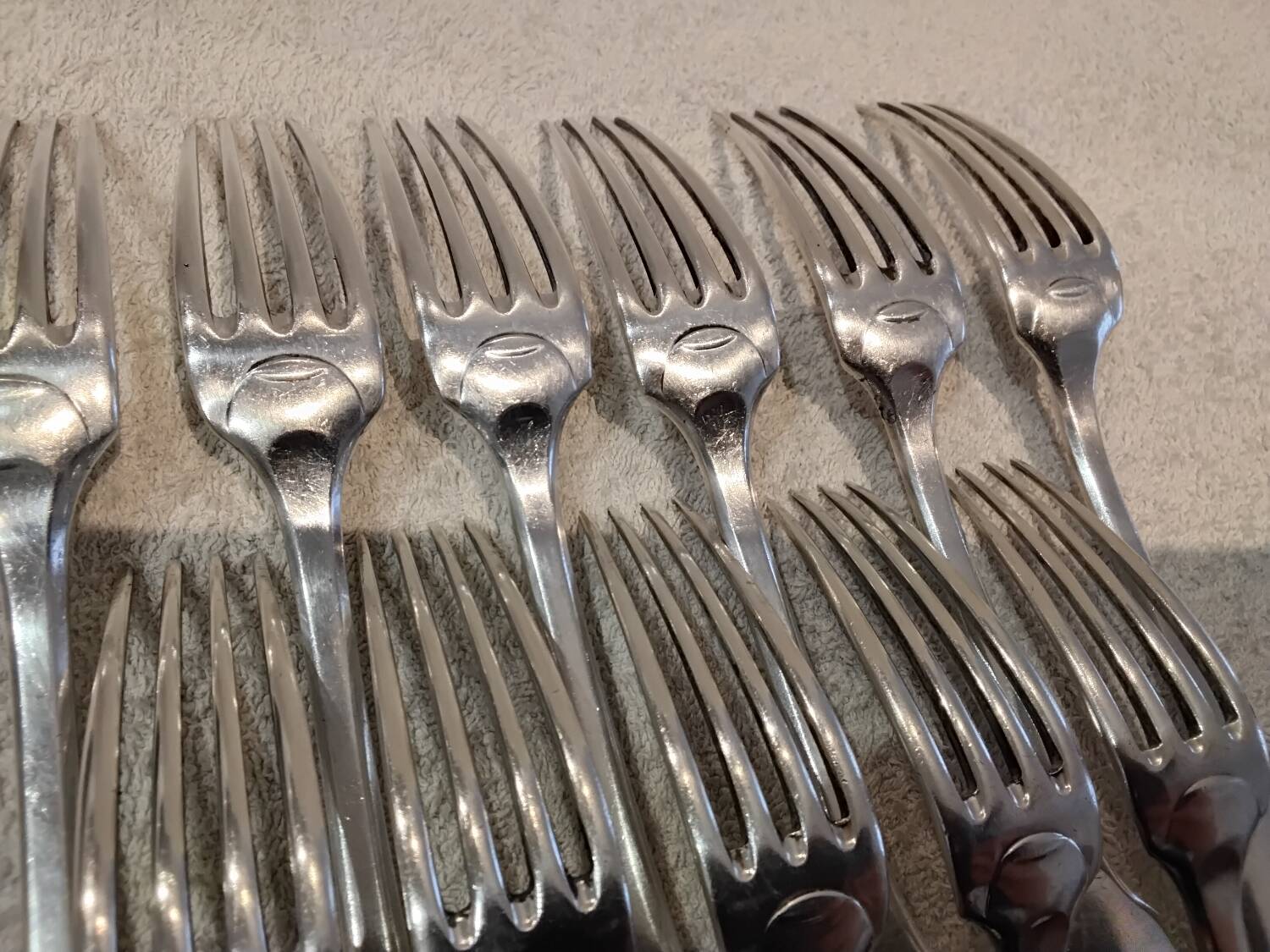 11 silver-plated table forks by Christofle Cluny with stripes