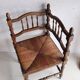 Antique corner chair "fireplace corner" in turned wood and straw.