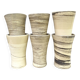 High ceramic cups made of mixed clay.