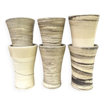High ceramic cups made of mixed clay.