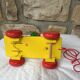 Old toy to pull Pinocchio and his xylophone