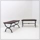 Set of 2 solid wood benches with an openwork design and wrought iron legs.