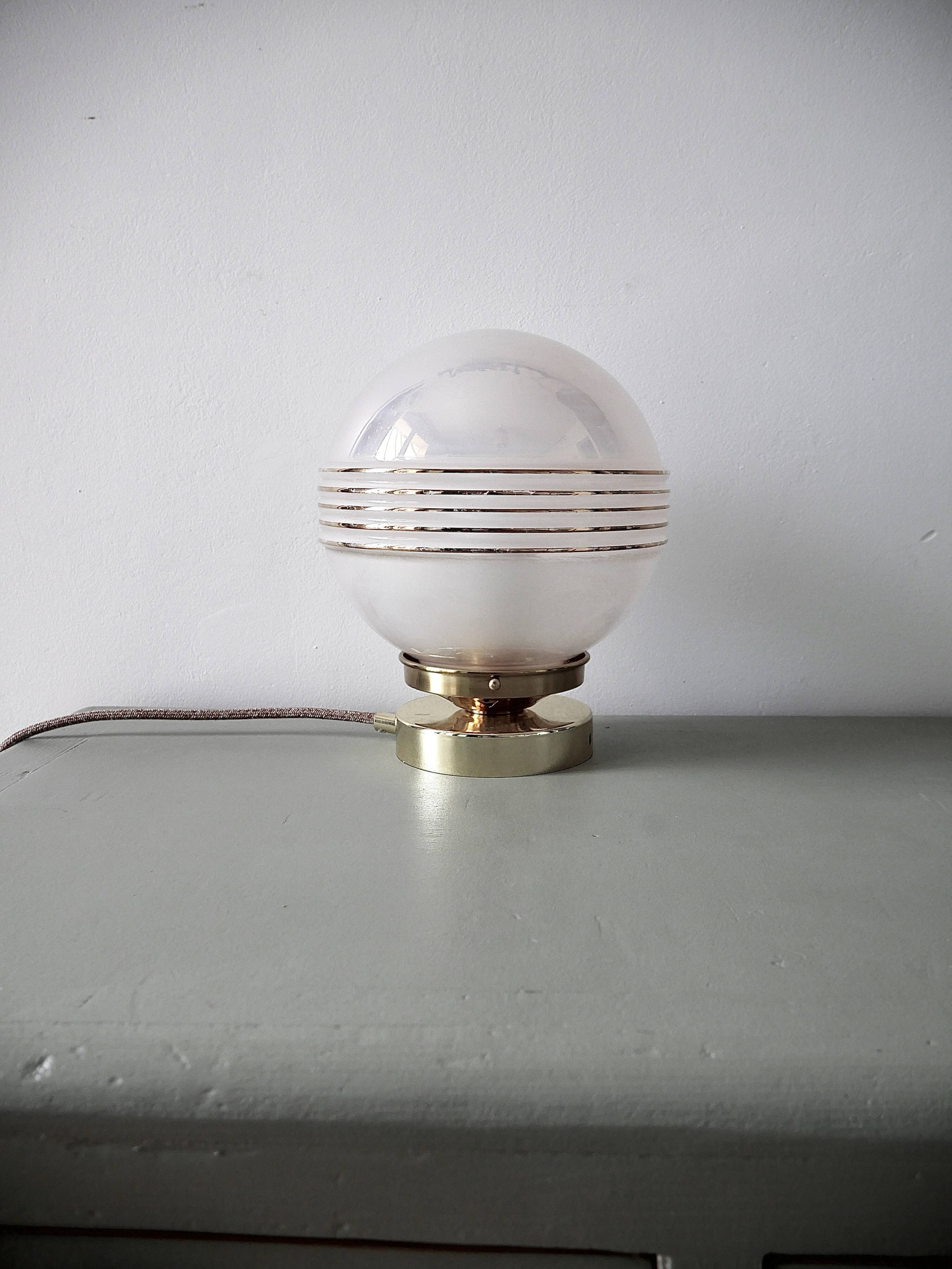 Pink iridescent glass lay lamp